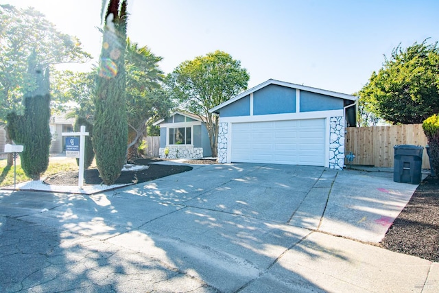 50 Montego Ct, Suisun City, CA 94585 - view of front of home featuring stone siding, driveway, stucco siding, and a garage