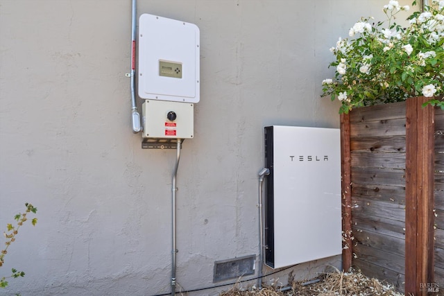 3641 Evergreen Ct, Napa, CA 94558 - exterior view of wall-mounted power storage, stucco siding, and related energy utilities
