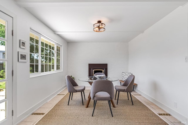 3641 Evergreen Ct, Napa, CA 94558 - dining area featuring baseboards, a brick fireplace, and light tile patterned floors