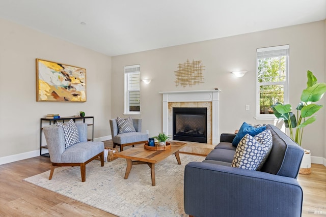 14600 Jomark Ln, Occidental, CA 95465 - living room with wood finished floors, baseboards, and a fireplace