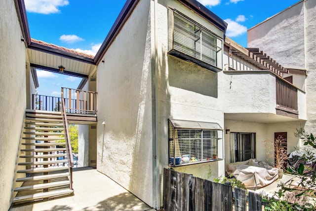 21100 Gary Dr Unit 215, Hayward, CA 94546 - view of home's exterior with stairway, a balcony, and stucco siding