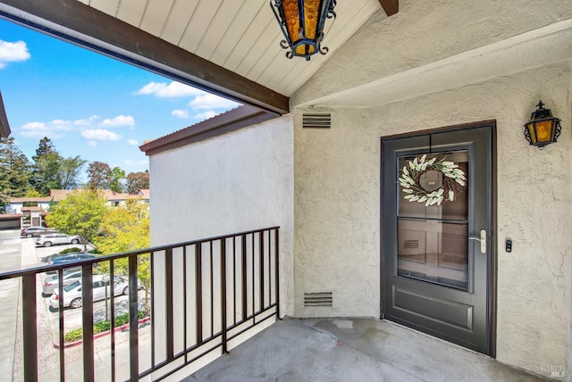 21100 Gary Dr Unit 215, Hayward, CA 94546 - view of exterior entry featuring stucco siding and a balcony