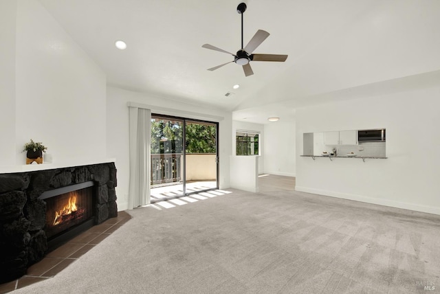 21100 Gary Dr Unit 215, Hayward, CA 94546 - unfurnished living room with carpet flooring, a stone fireplace, a ceiling fan, recessed lighting, and high vaulted ceiling