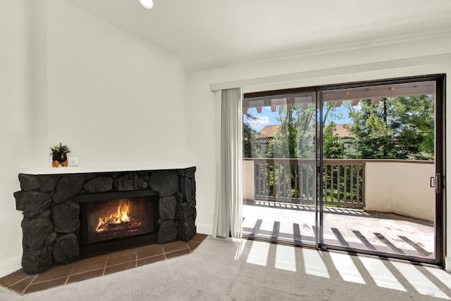 21100 Gary Dr Unit 215, Hayward, CA 94546 - unfurnished living room featuring plenty of natural light, a fireplace, vaulted ceiling, baseboards, and carpet floors