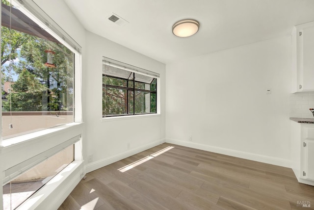 21100 Gary Dr Unit 215, Hayward, CA 94546 - unfurnished dining area featuring light wood finished floors and baseboards
