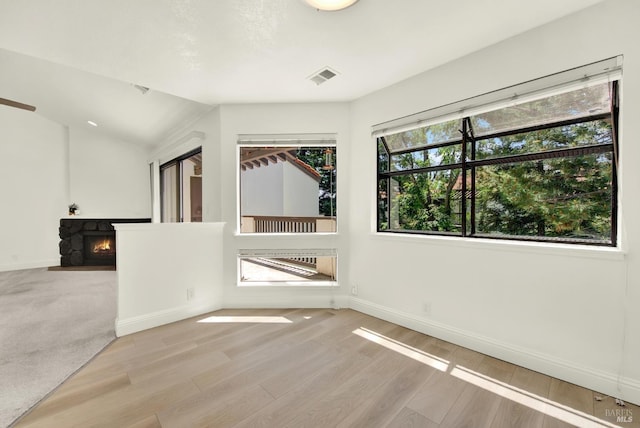 21100 Gary Dr Unit 215, Hayward, CA 94546 - empty room with baseboards, light wood finished floors, and a fireplace