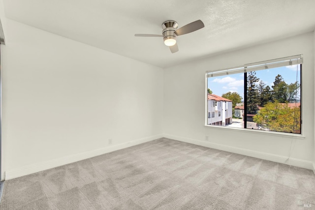 21100 Gary Dr Unit 215, Hayward, CA 94546 - empty room featuring light colored carpet, baseboards, and a ceiling fan