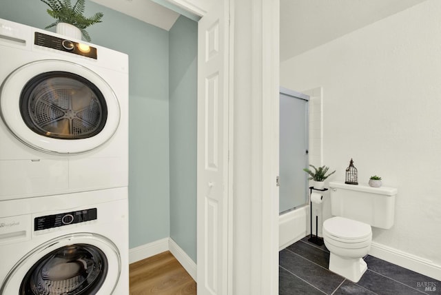 21100 Gary Dr Unit 215, Hayward, CA 94546 - laundry room featuring stacked washing machine and dryer and baseboards