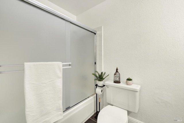21100 Gary Dr Unit 215, Hayward, CA 94546 - bathroom featuring toilet, enclosed tub / shower combo, and baseboards