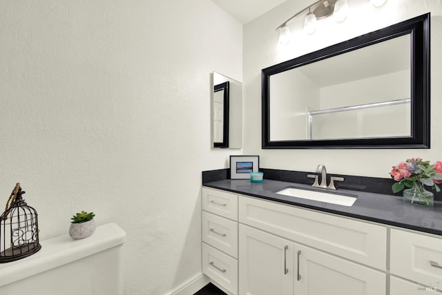21100 Gary Dr Unit 215, Hayward, CA 94546 - full bathroom featuring toilet, vanity, and baseboards