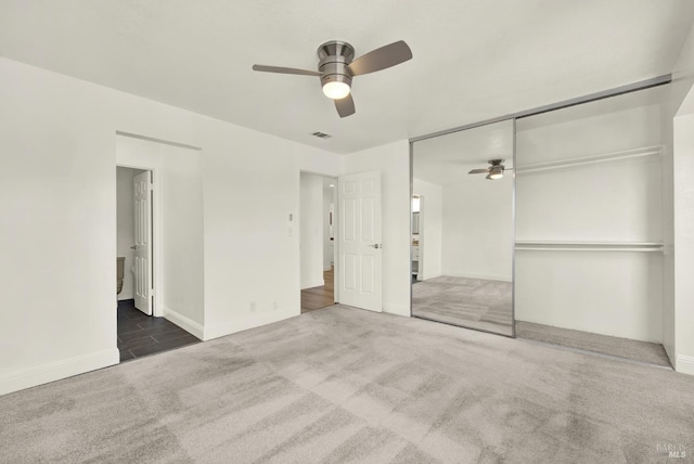 21100 Gary Dr Unit 215, Hayward, CA 94546 - unfurnished bedroom with carpet floors, baseboards, a closet, and a ceiling fan