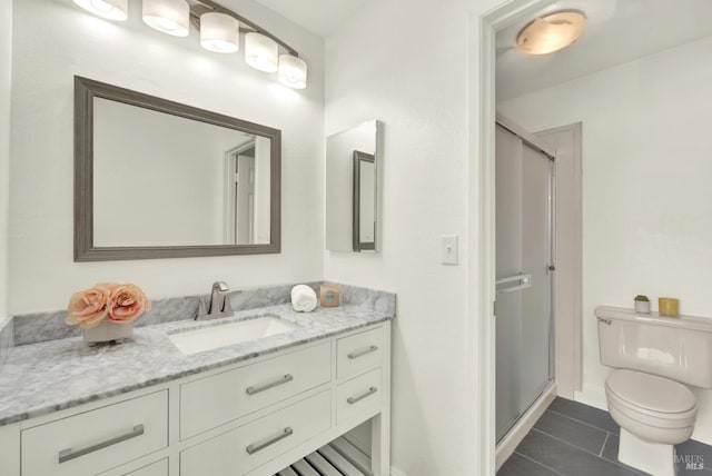 21100 Gary Dr Unit 215, Hayward, CA 94546 - bathroom featuring vanity, toilet, a shower stall, and tile patterned flooring