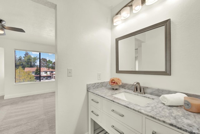 21100 Gary Dr Unit 215, Hayward, CA 94546 - bathroom featuring vanity, baseboards, and ceiling fan