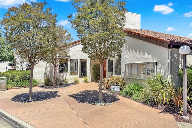 21100 Gary Dr Unit 215, Hayward, CA 94546 - view of front of home with stucco siding and a tiled roof