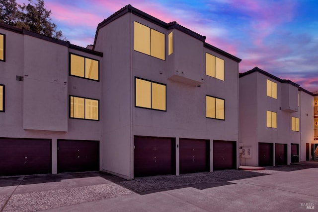 21100 Gary Dr Unit 215, Hayward, CA 94546 - property at dusk featuring an attached garage