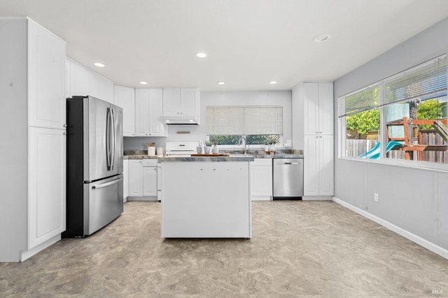6576 Jade Ct, Rohnert Park, CA 94928 - kitchen with appliances with stainless steel finishes, under cabinet range hood, a sink, white cabinets, and recessed lighting