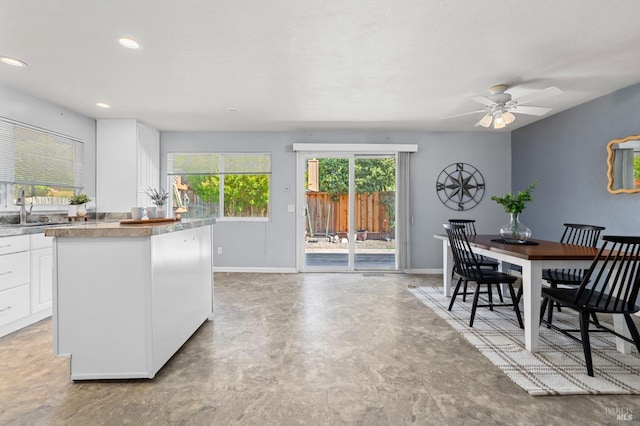 6576 Jade Ct, Rohnert Park, CA 94928 - kitchen with white cabinets, a ceiling fan, baseboards, a sink, and recessed lighting