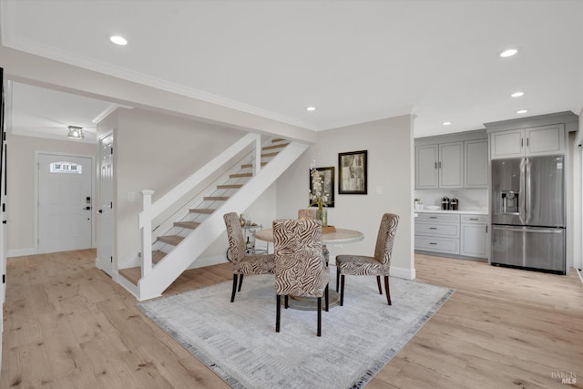 323 Larkin Ct, Benicia, CA 94510 - dining area featuring stairway, light wood-type flooring, recessed lighting, baseboards, and ornamental molding