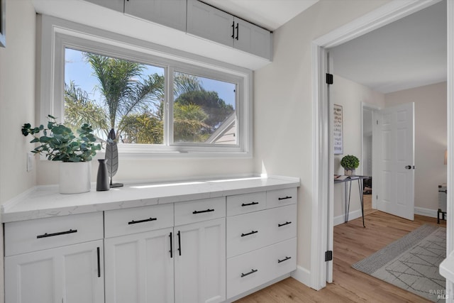 323 Larkin Ct, Benicia, CA 94510 - hall with healthy amount of natural light, baseboards, and light wood-type flooring