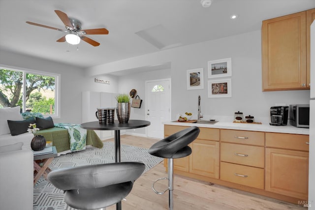 323 Larkin Ct, Benicia, CA 94510 - kitchen with a sink, light brown cabinetry, light wood finished floors, light countertops, and recessed lighting