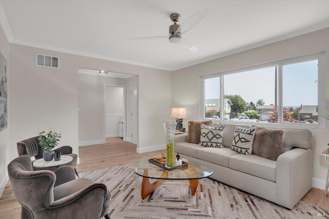 323 Larkin Ct, Benicia, CA 94510 - living room featuring ceiling fan, baseboards, light wood-style floors, and crown molding