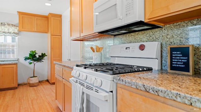 701 Nevada St, Fairfield, CA 94533 - kitchen featuring white appliances, backsplash, light wood-style floors, light stone counters, and recessed lighting