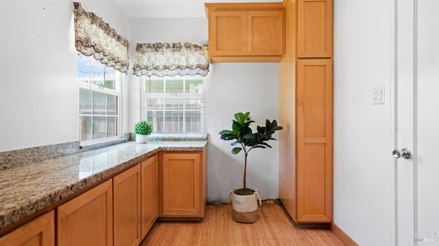 701 Nevada St, Fairfield, CA 94533 - kitchen with light wood-type flooring and brown cabinets