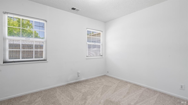 701 Nevada St, Fairfield, CA 94533 - unfurnished room with carpet flooring, a textured ceiling, and baseboards