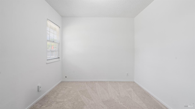 701 Nevada St, Fairfield, CA 94533 - empty room with light colored carpet, baseboards, and a textured ceiling