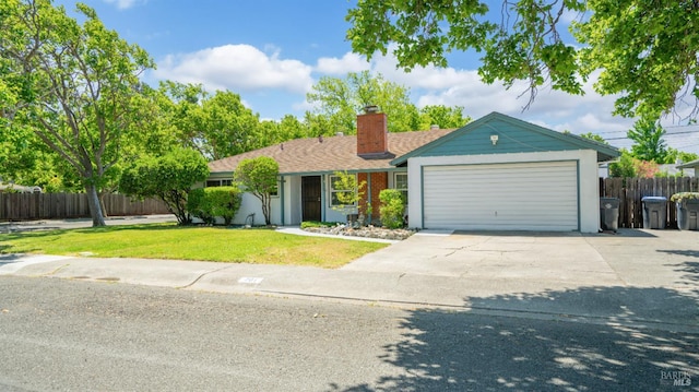 701 Nevada St, Fairfield, CA 94533 - ranch-style house with a chimney, concrete driveway, and an attached garage