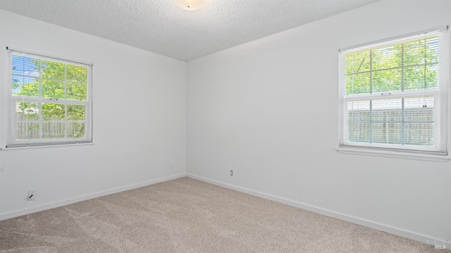 701 Nevada St, Fairfield, CA 94533 - unfurnished room featuring carpet floors, healthy amount of natural light, baseboards, and a textured ceiling