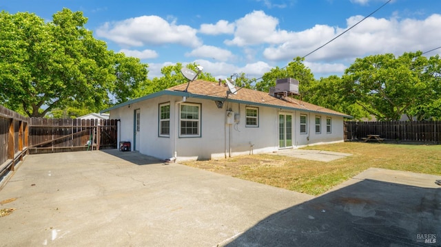 701 Nevada St, Fairfield, CA 94533 - back of property featuring stucco siding and a patio area