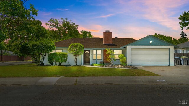 701 Nevada St, Fairfield, CA 94533 - single story home featuring concrete driveway, a chimney, a garage, and a front lawn