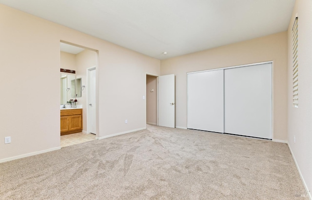 619 Turnberry Ter, Rio Vista, CA 94571 - unfurnished bedroom with light colored carpet, a closet, ensuite bathroom, and baseboards