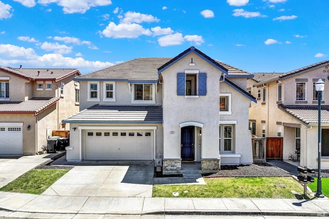 2467 Flatley Cir, Fairfield, CA 94533 - view of front of home featuring stucco siding, driveway, an attached garage, and a tile roof