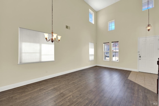 2467 Flatley Cir, Fairfield, CA 94533 - foyer featuring a high ceiling, dark wood finished floors, a chandelier, and baseboards
