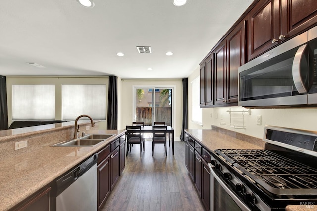 2467 Flatley Cir, Fairfield, CA 94533 - kitchen with appliances with stainless steel finishes, a sink, dark wood finished floors, recessed lighting, and light countertops