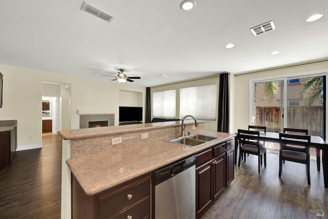 2467 Flatley Cir, Fairfield, CA 94533 - kitchen with dishwasher, a sink, a center island with sink, a ceiling fan, and dark wood-style flooring