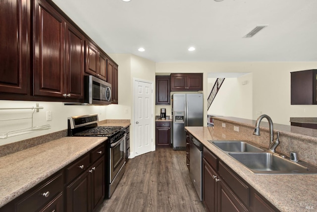 2467 Flatley Cir, Fairfield, CA 94533 - kitchen with appliances with stainless steel finishes, a sink, dark wood finished floors, recessed lighting, and light countertops