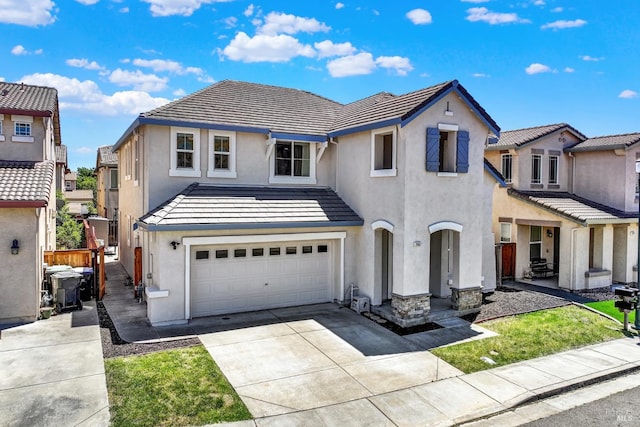 2467 Flatley Cir, Fairfield, CA 94533 - view of front of property with stucco siding, an attached garage, driveway, and a tile roof