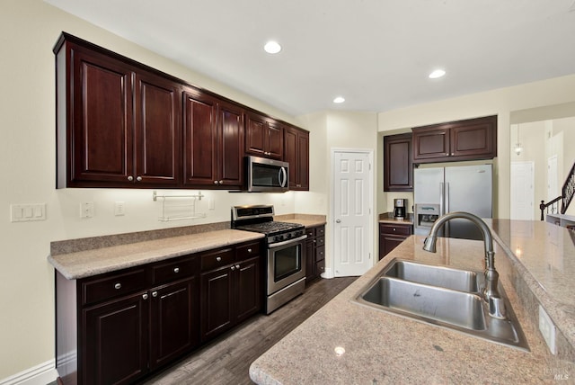 2467 Flatley Cir, Fairfield, CA 94533 - kitchen with stainless steel appliances, a sink, dark wood-style floors, light countertops, and recessed lighting