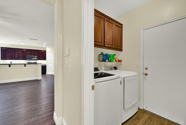 2467 Flatley Cir, Fairfield, CA 94533 - laundry room with dark wood-type flooring, washer and clothes dryer, cabinet space, and recessed lighting