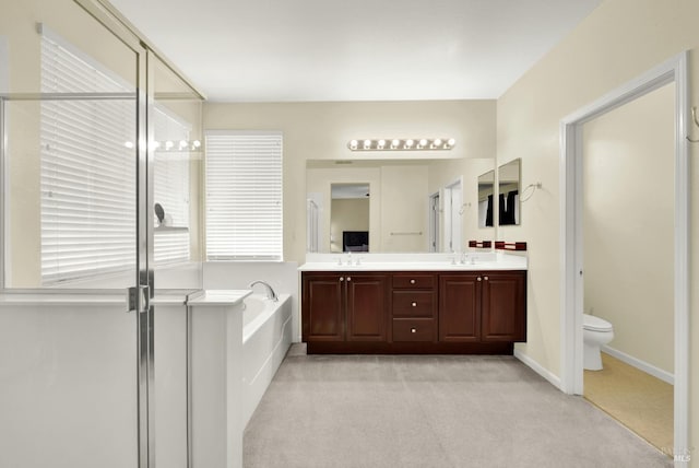2467 Flatley Cir, Fairfield, CA 94533 - bathroom featuring double vanity, a bath, a stall shower, toilet, and healthy amount of natural light