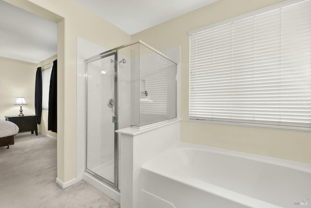 2467 Flatley Cir, Fairfield, CA 94533 - bathroom featuring a stall shower, a garden tub, ensuite bath, and baseboards