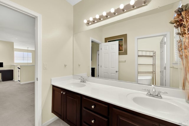 2467 Flatley Cir, Fairfield, CA 94533 - full bathroom featuring double vanity, toilet, and baseboards