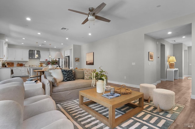 2579 Estery Ln, Santa Rosa, CA 95403 - living area featuring light wood-style floors, a ceiling fan, recessed lighting, and baseboards