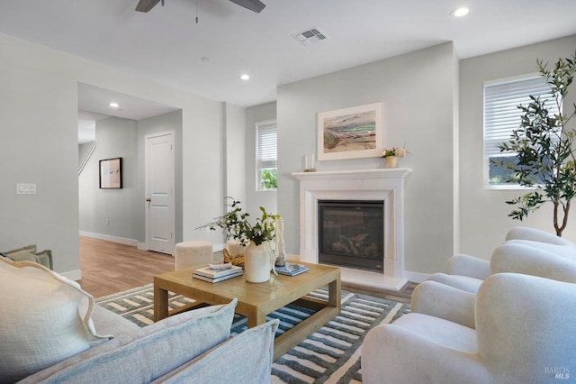 2579 Estery Ln, Santa Rosa, CA 95403 - living room featuring recessed lighting, wood finished floors, a glass covered fireplace, baseboards, and a ceiling fan
