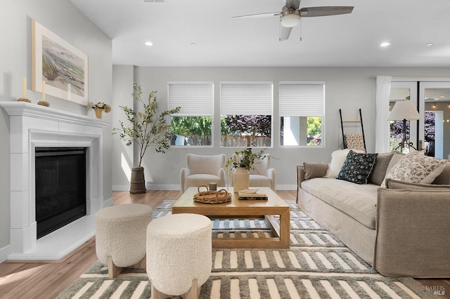 2579 Estery Ln, Santa Rosa, CA 95403 - living area featuring plenty of natural light, wood finished floors, ceiling fan, a glass covered fireplace, and recessed lighting