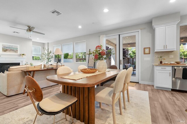 2579 Estery Ln, Santa Rosa, CA 95403 - dining area featuring light wood-style floors, recessed lighting, ceiling fan, a glass covered fireplace, and baseboards