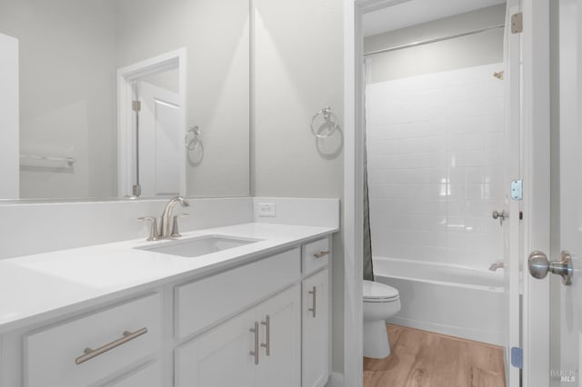 2579 Estery Ln, Santa Rosa, CA 95403 - full bathroom with vanity, wood finished floors, toilet, and shower / bath combo with shower curtain